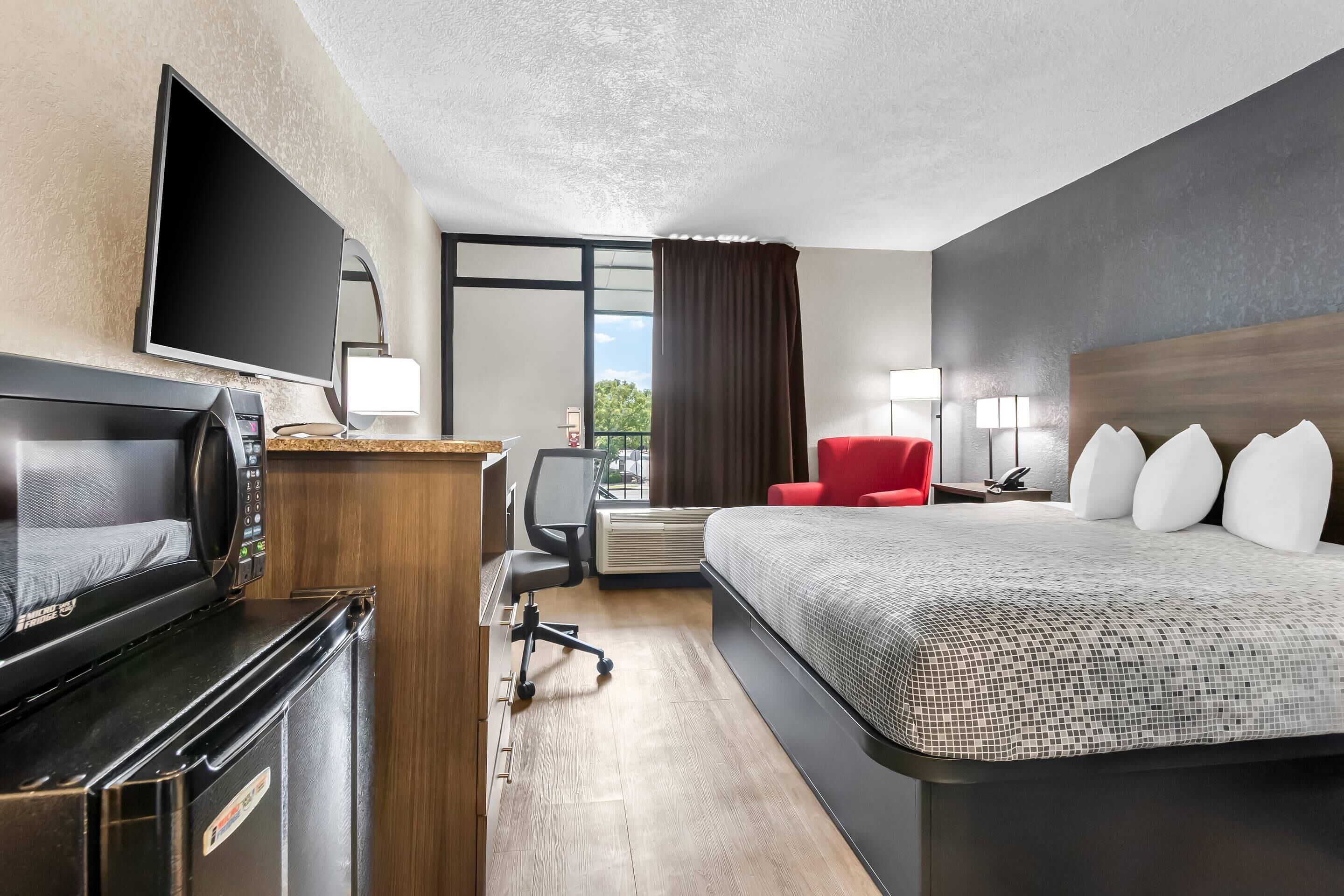 Room, 1 King Bed, Non Smoking | Desk, laptop workspace, blackout drapes, iron/ironing board