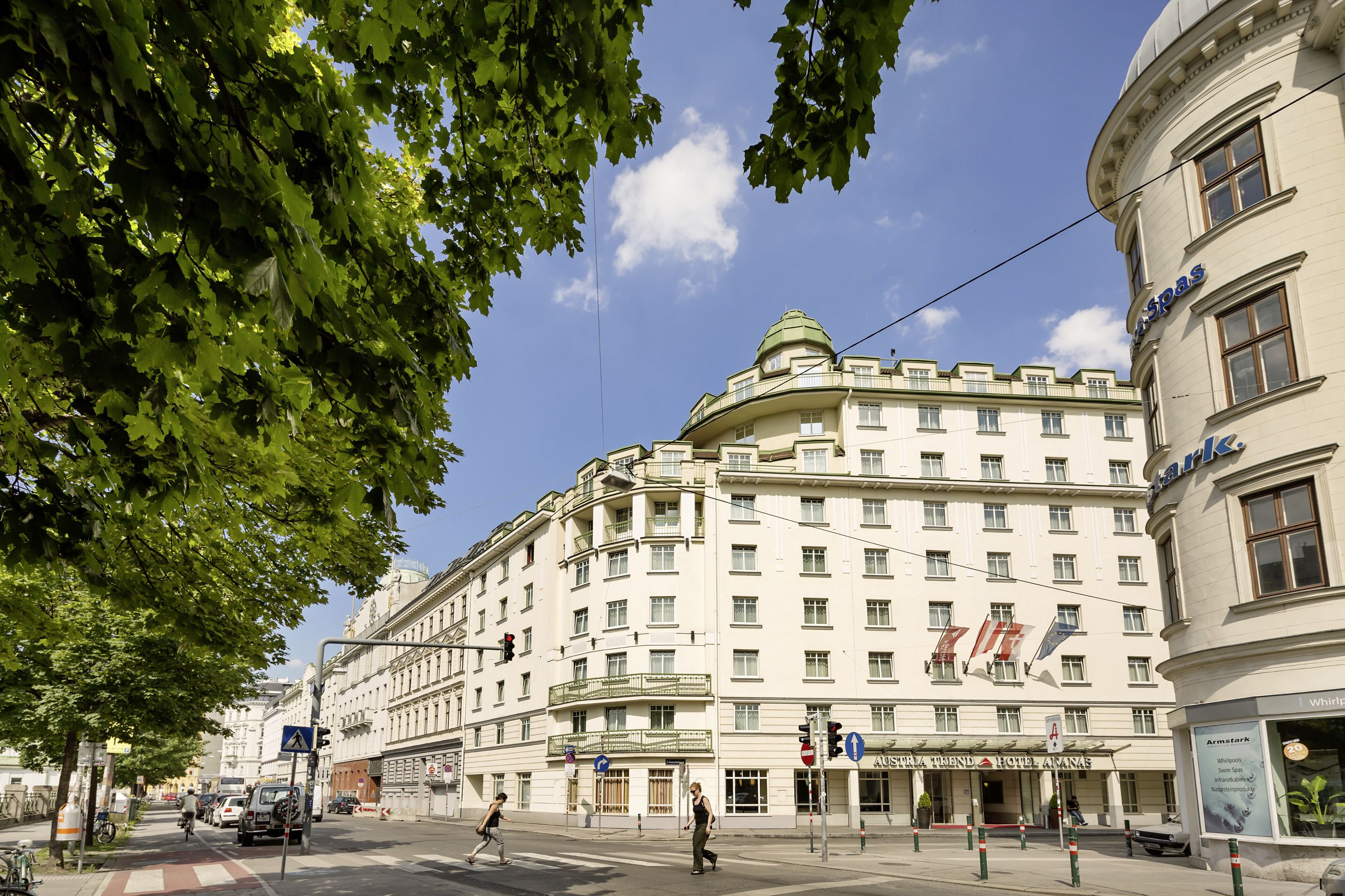 A large, historic building with multiple floors and a prominent dome, likely a hotel or public building.