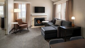 A modern living room with a fireplace, a flat-screen TV, and a sofa. - Residence Inn by Marriott Pasadena Arcadia (Arcadia)