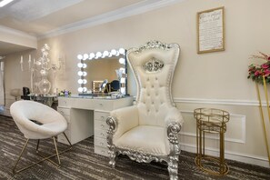 A luxurious vanity area with a large mirror, ornate chair, and a vanity with drawers. - Best Western Battlefield Inn-Manassas (Manassas)