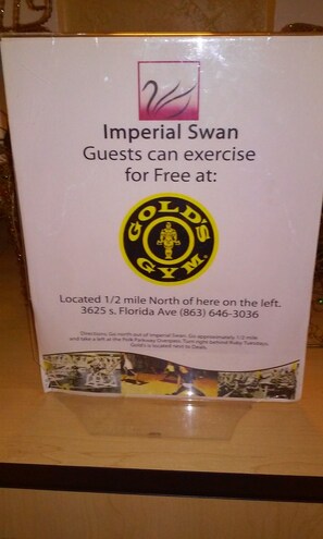A sign for Imperial Swan Gym, indicating guests can exercise for free. - Imperial Swan Hotel & Suites (Lakeland)