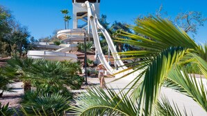 A water park with multiple slides and a tower structure.