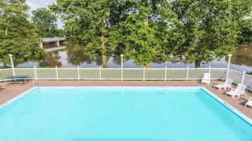 Seasonal outdoor pool, pool loungers