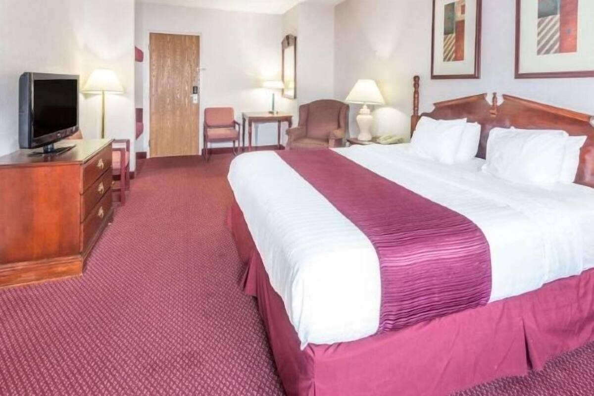 Desk, laptop workspace, blackout curtains, iron/ironing board