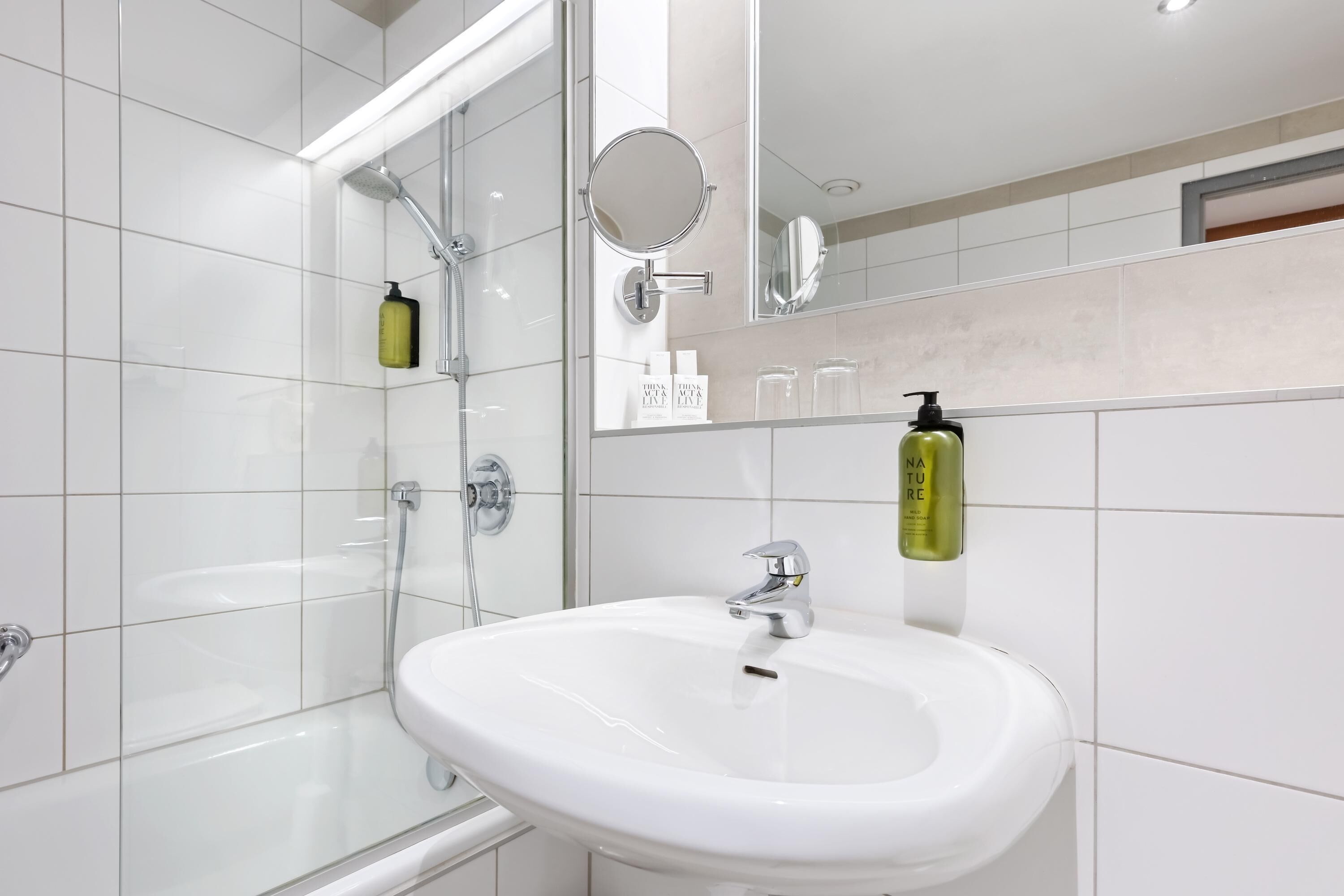 bathtub, hair dryer, towels