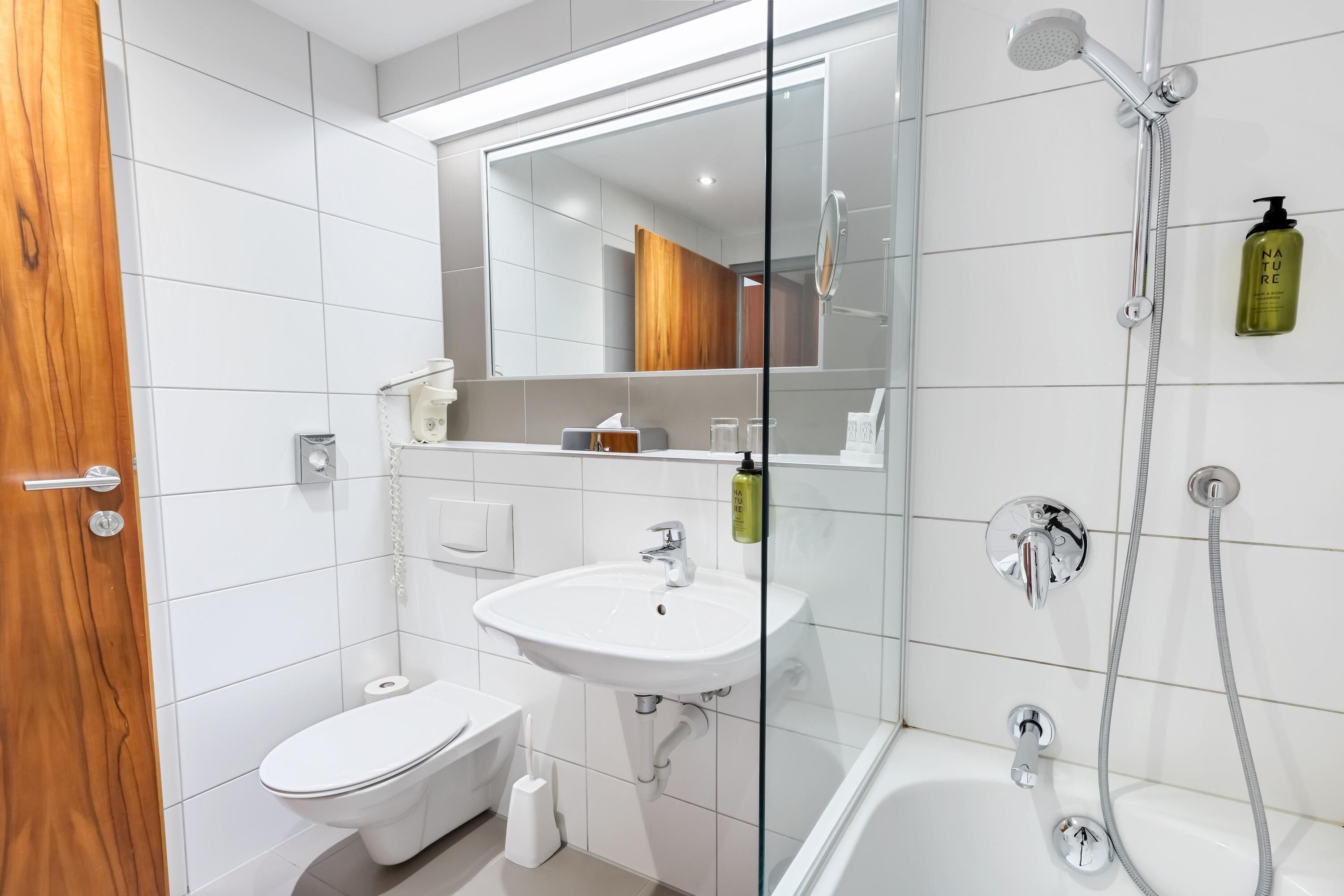 bathtub, hair dryer, towels