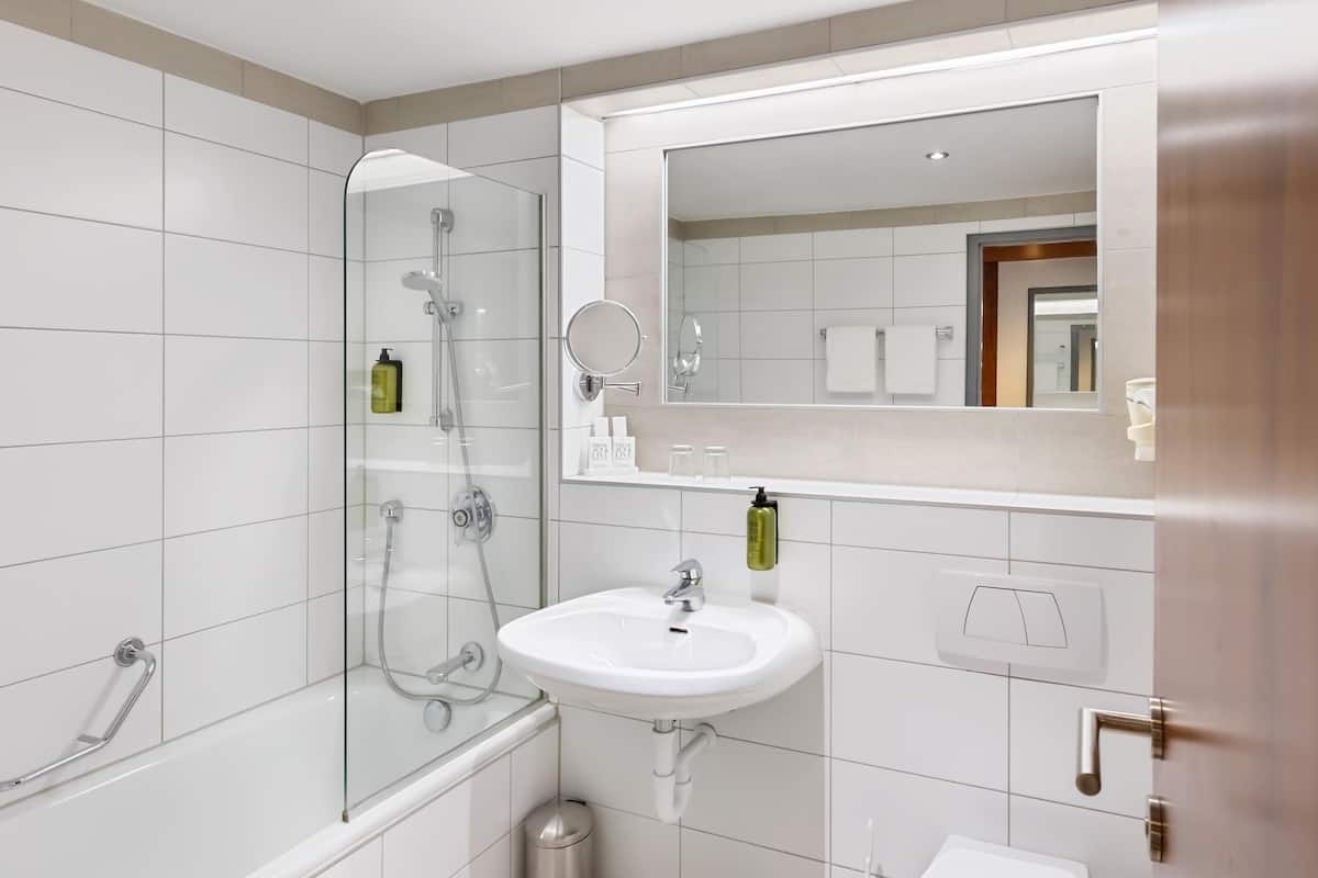 premium room | bathroom | bathtub, hair dryer, towels