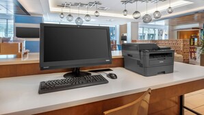 A modern office space with a desktop computer, keyboard, mouse, and printer on a white desk. - Holiday Inn Express Denver Downtown by IHG (Denver)