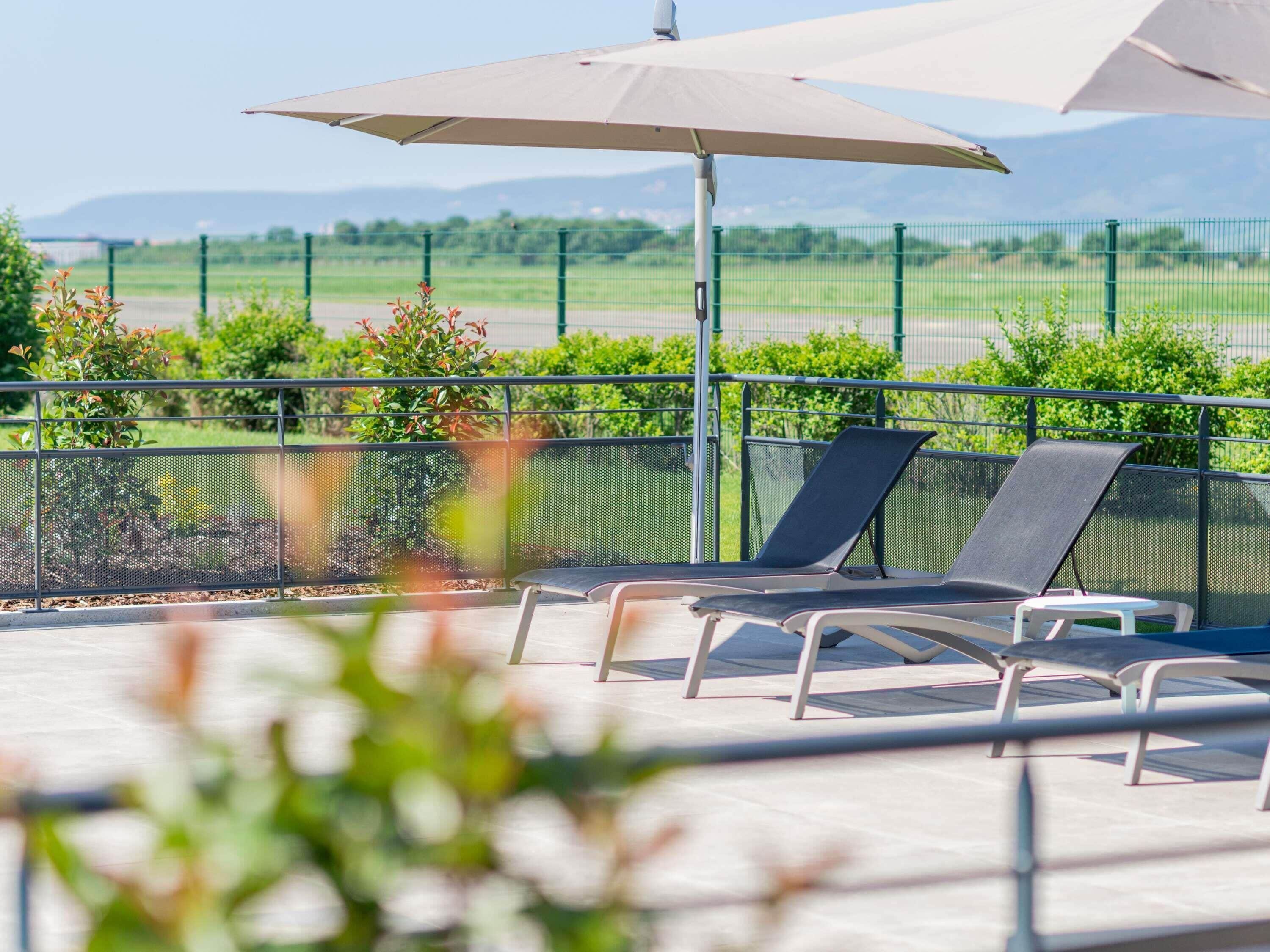 Seasonal outdoor pool, pool umbrellas, pool loungers