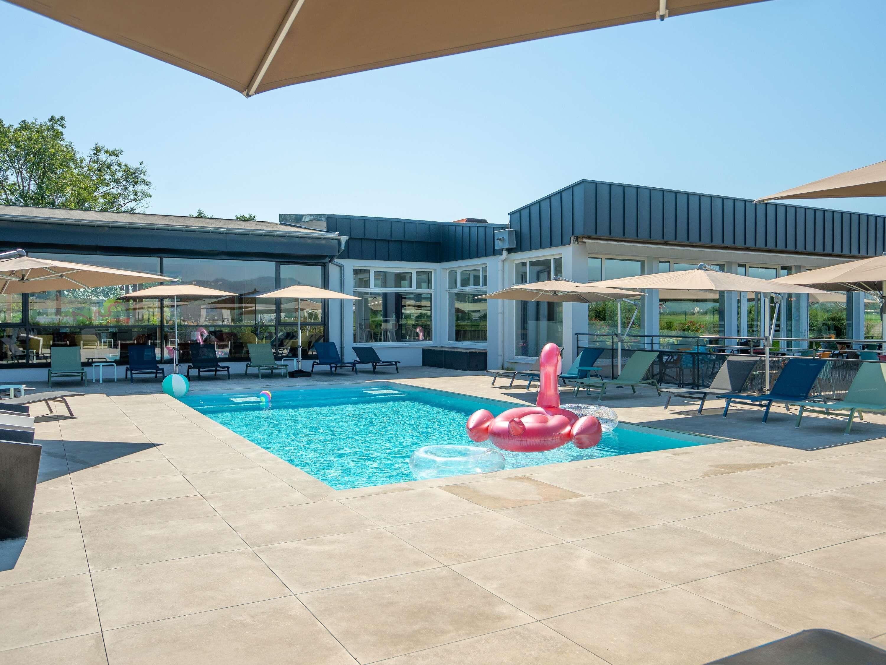 Seasonal outdoor pool, pool umbrellas, pool loungers
