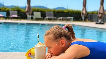 Seasonal outdoor pool, pool umbrellas, pool loungers