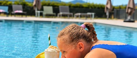 Seasonal outdoor pool, pool umbrellas, pool loungers