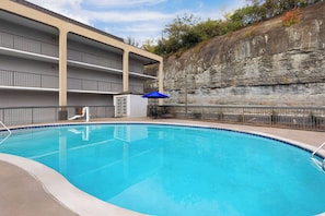 Seasonal outdoor pool, open 8:00 AM to 10:00 PM, pool umbrellas