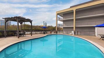 Seasonal outdoor pool, open 8:00 AM to 10:00 PM, pool umbrellas