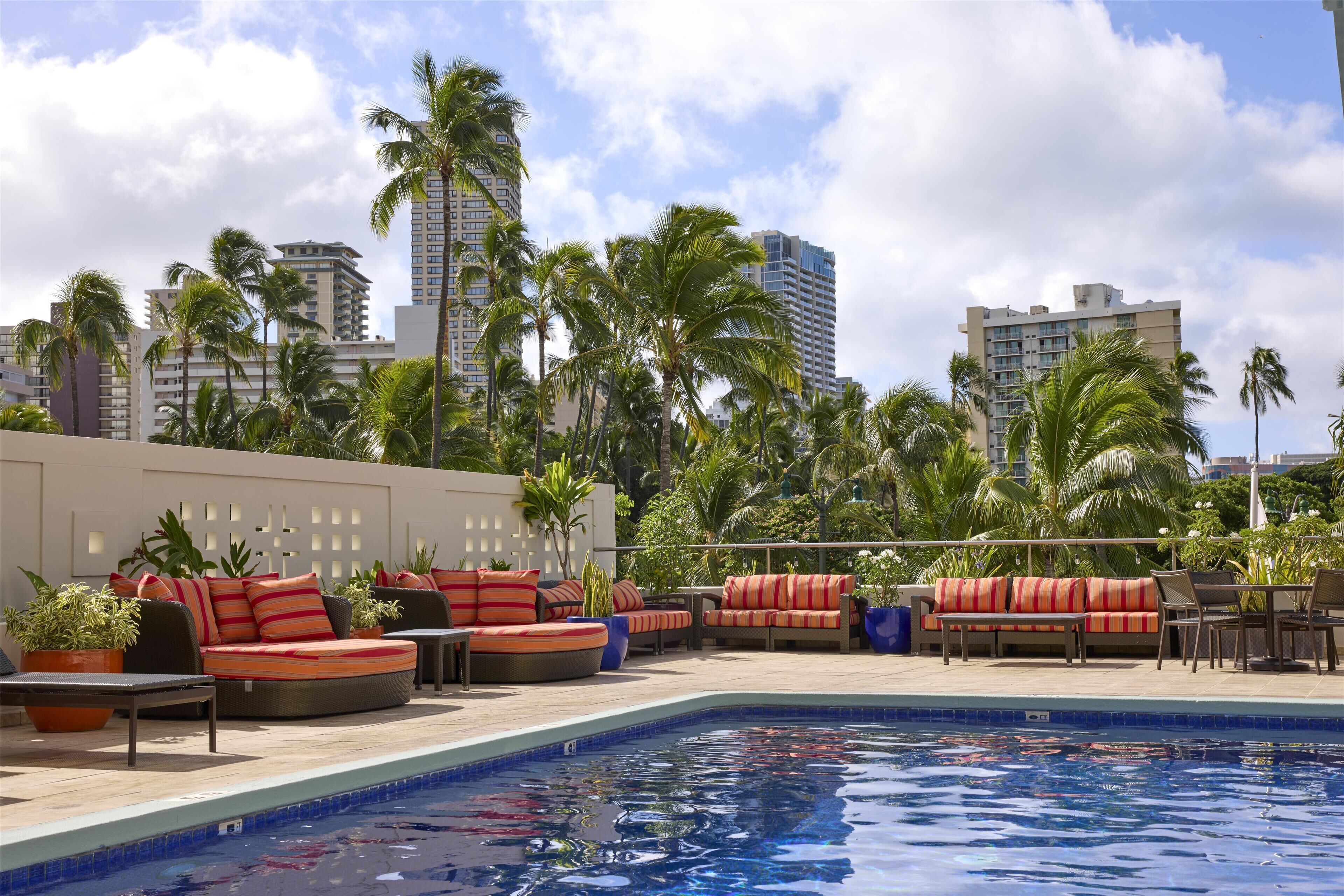 Outdoor pool, open 6 AM to 10 PM, pool umbrellas, sun loungers