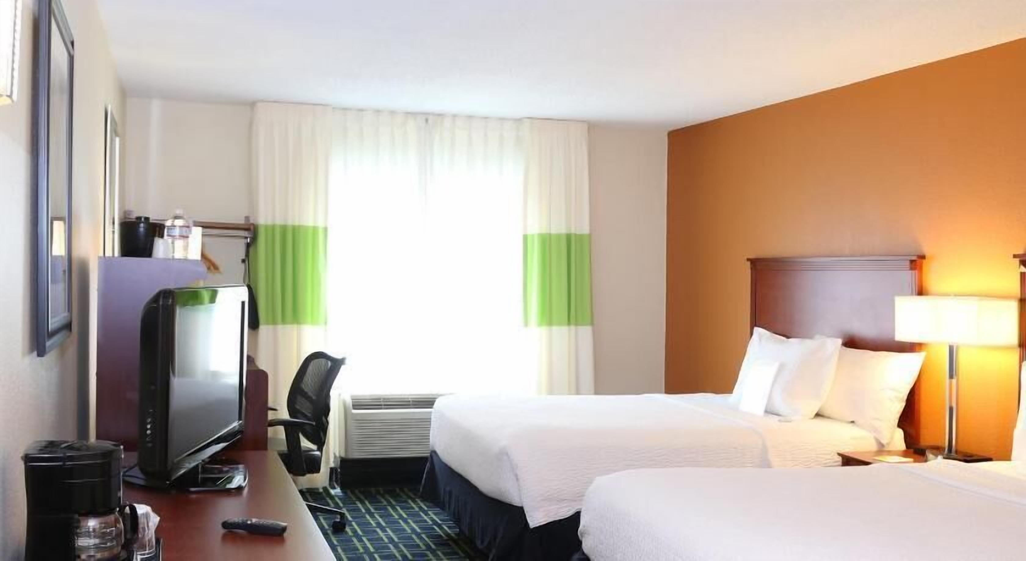Hypo-allergenic bedding, pillowtop beds, desk, blackout drapes