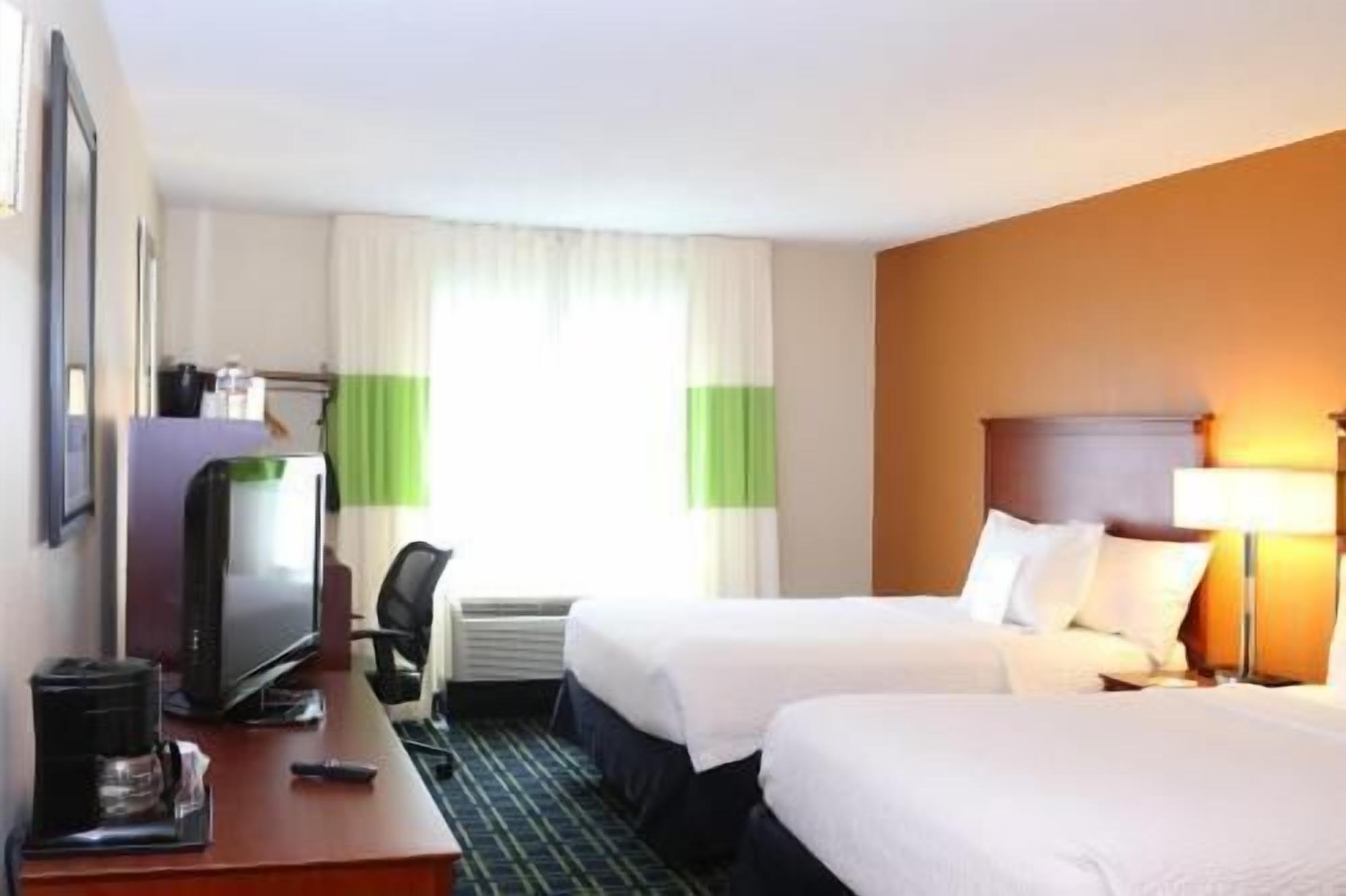 Hypo-allergenic bedding, pillowtop beds, desk, blackout drapes