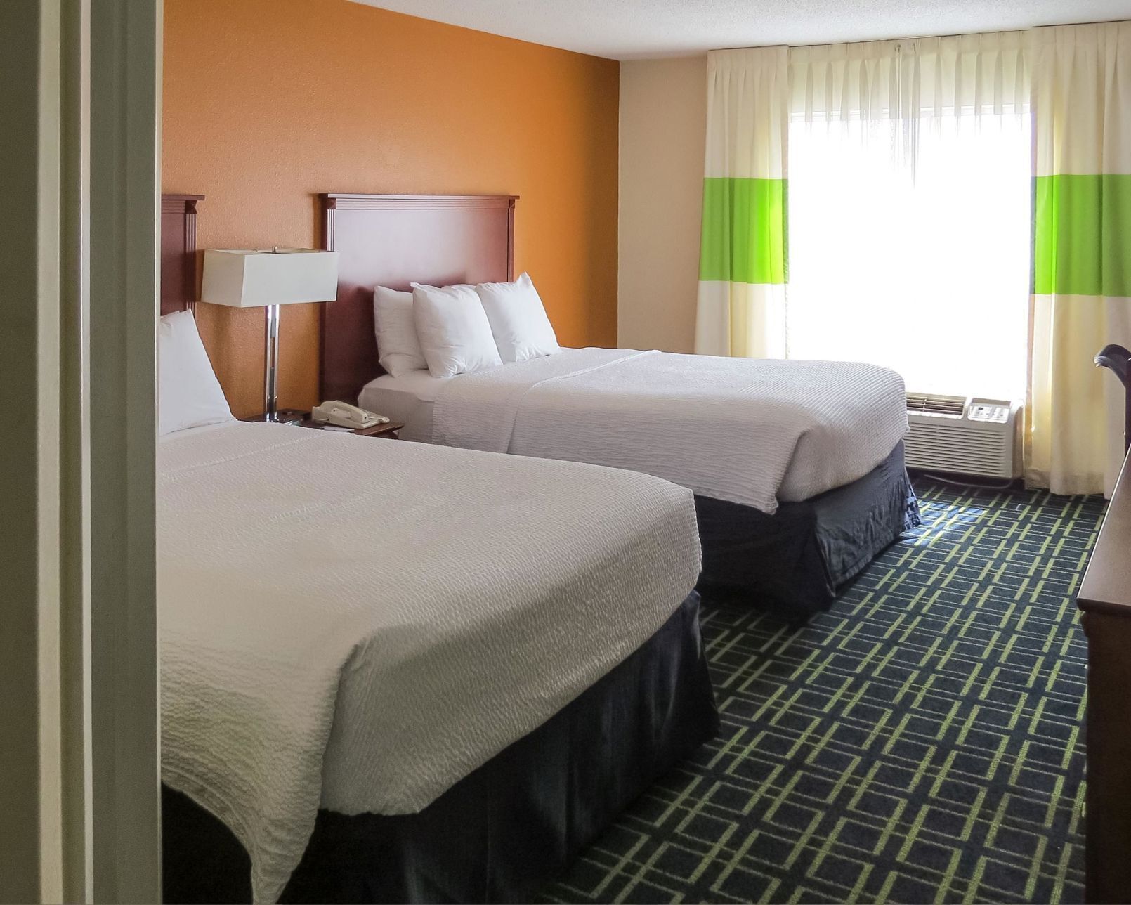Hypo-allergenic bedding, pillowtop beds, desk, blackout drapes