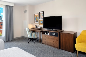 A hotel room with a bed, a desk with a computer, a television, a chair, and a wardrobe. - Hampton Inn by Hilton Halifax Downtown (Halifax)