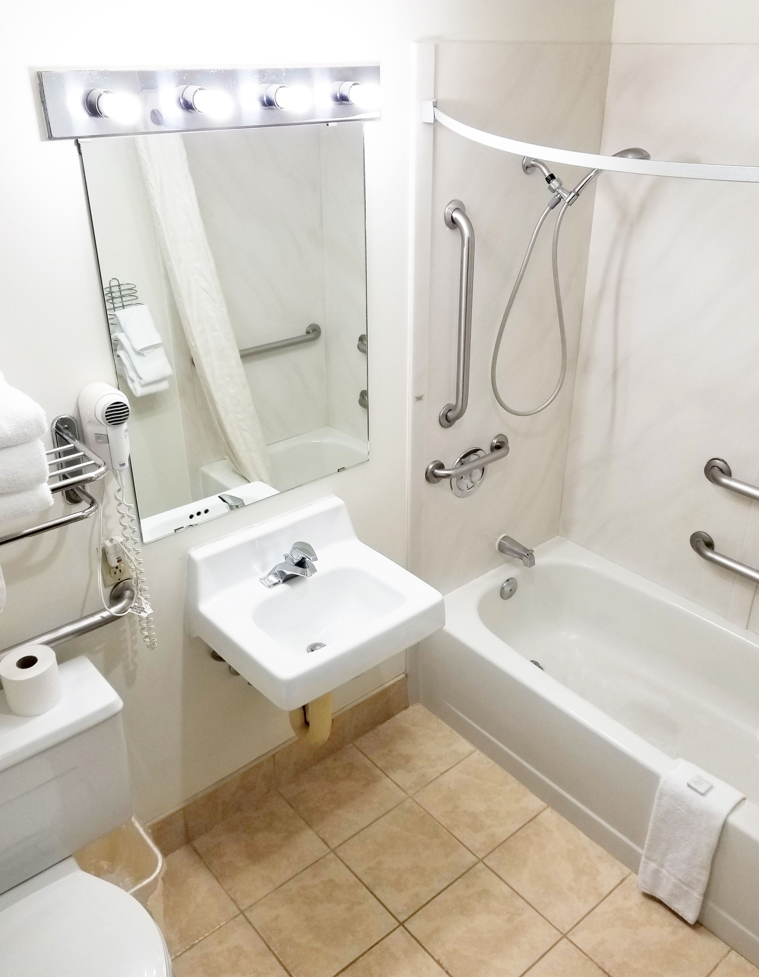 deluxe room, 2 queen beds, accessible, refrigerator & microwave | bathroom | combined shower/bathtub, eco-friendly toiletries, hair dryer, towels