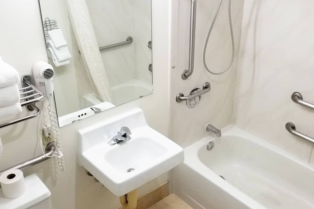 deluxe room, 2 queen beds, accessible, refrigerator & microwave | bathroom | combined shower/bathtub, eco-friendly toiletries, hair dryer, towels