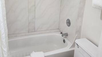 Deluxe Room, 2 Queen Beds, Refrigerator & Microwave | Bathroom | Combined shower/tub, towels
