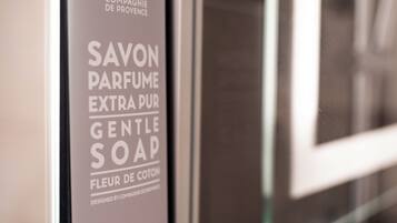 A sign for 'Savon Parfum Extra Pur Gentle Soap' by Compagnie de Provence.