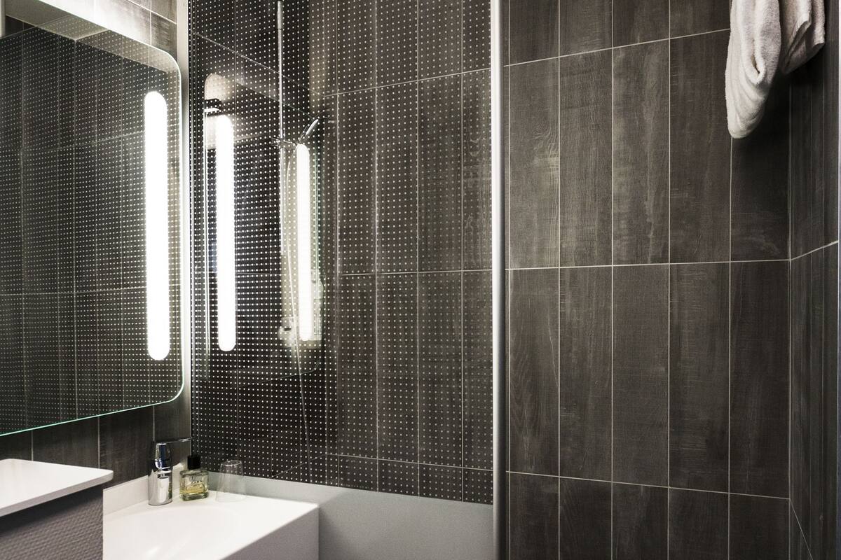 shower, eco-friendly toiletries, hair dryer, towels