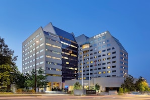 A modern hotel building with multiple floors, large windows, and a prominent 'LOEWS' sign. - Loews Nashville Hotel at Vanderbilt Plaza (Nashville)