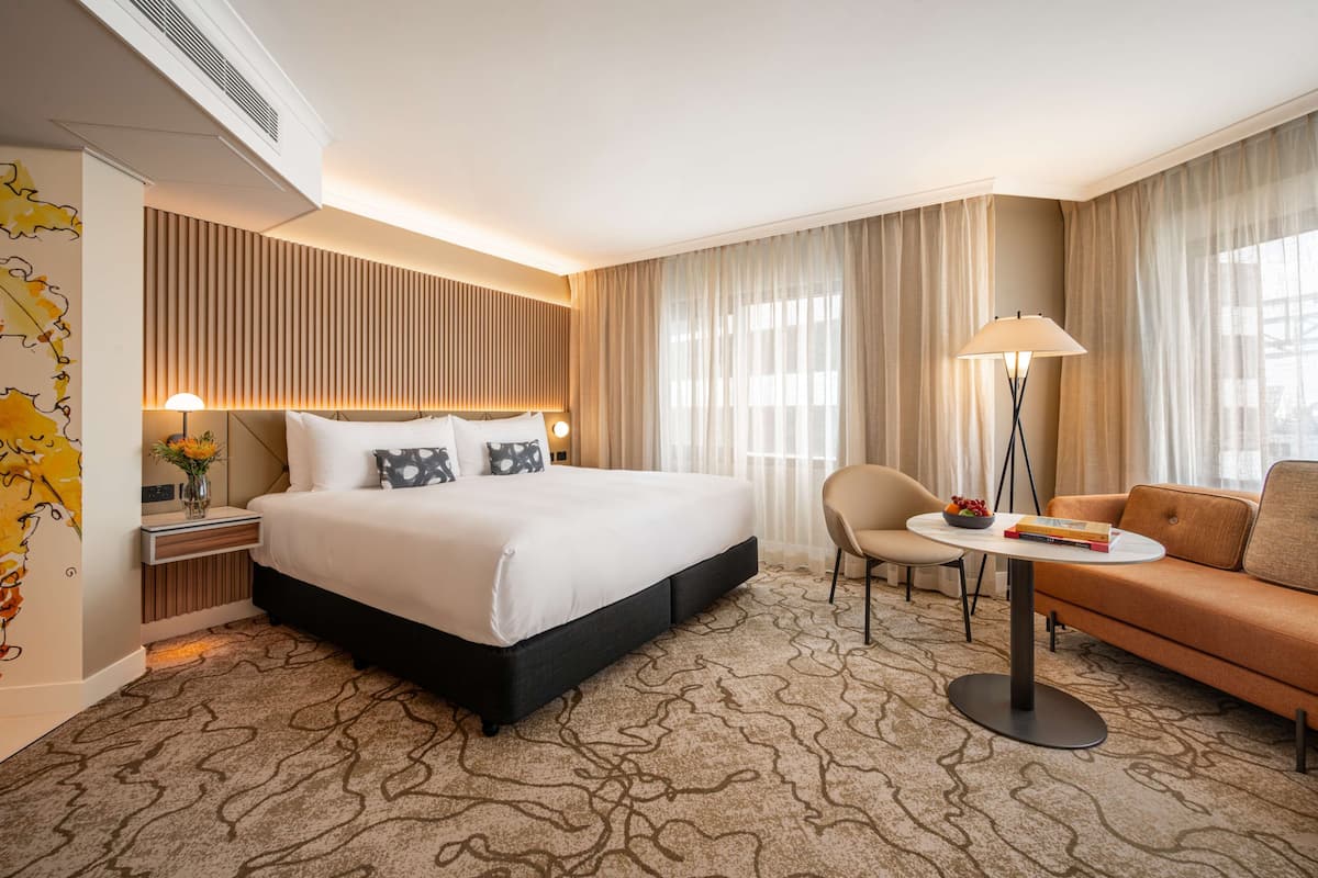 deluxe king corner | premium bedding, in-room safe, desk, laptop workspace