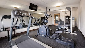 A gym with treadmills, elliptical machines, and a mirrored wall. - Best Western Kendallville Inn (Kendallville)