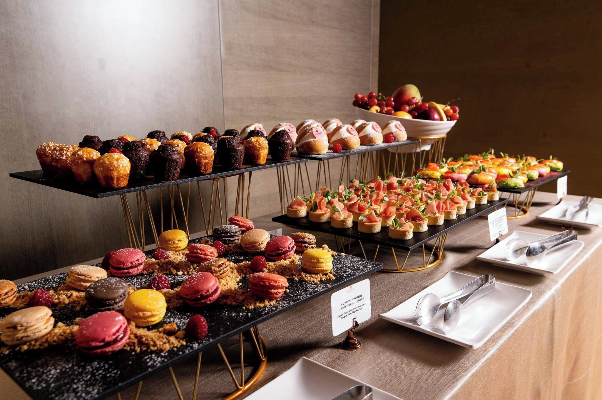 A buffet with various desserts and appetizers.