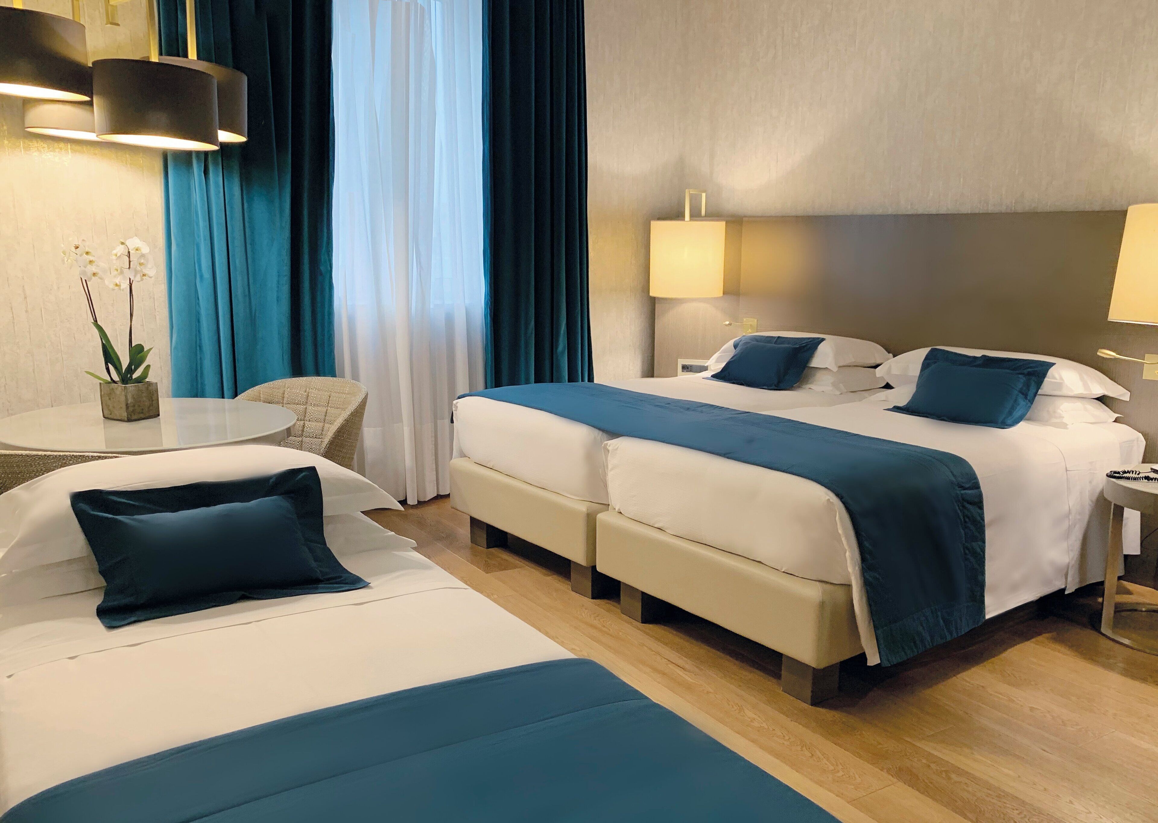 Family Triple Room | Premium bedding, minibar, in-room safe, desk