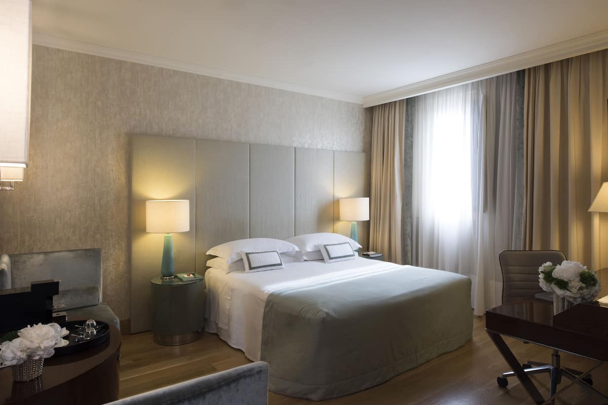 2 habitaciones, ropa de cama de alta calidad y minibar