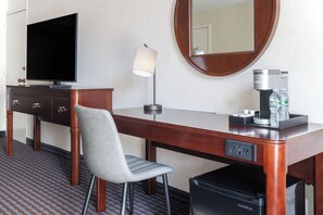 Desk, laptop workspace, blackout drapes, iron/ironing board