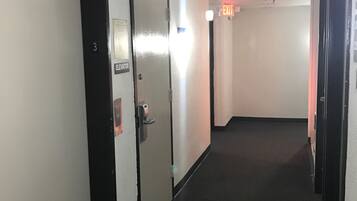 A hallway with a door labeled "Elevator" and "3" indicating the floor level.