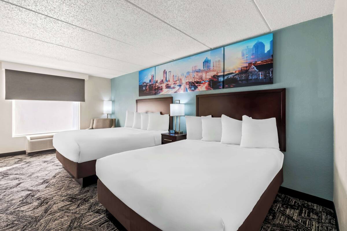 Premium bedding, desk, laptop workspace, blackout curtains