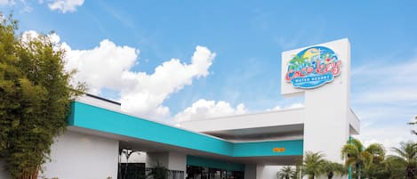 A building with a sign for Coco Key Water Resort, featuring a modern design with a blue and white color scheme.