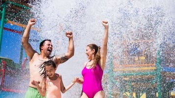 Family fun awaits at our water park, where kids can splash and play on the colorful play structure with its exciting slides and equipment.