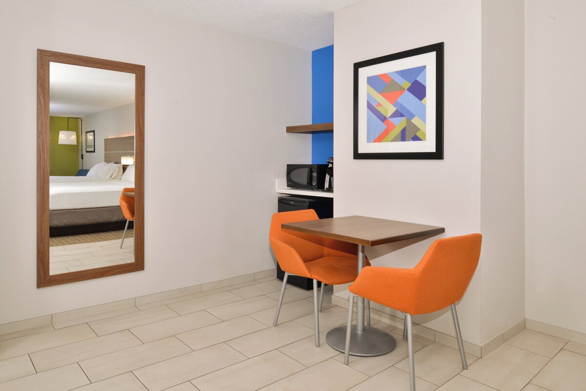 Suite, 2 Queen Beds (Living Area) | In-room safe, desk, iron/ironing board, cribs (free)