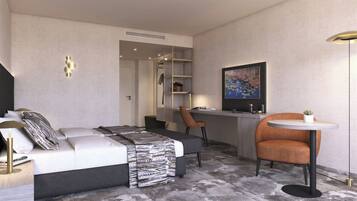 A modern hotel room with a bed, a desk, a chair, a small table, and a painting on the wall.