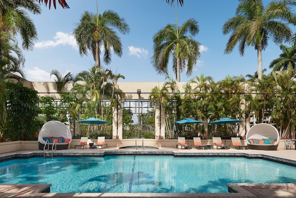 Outdoor pool, free pool cabanas, pool umbrellas