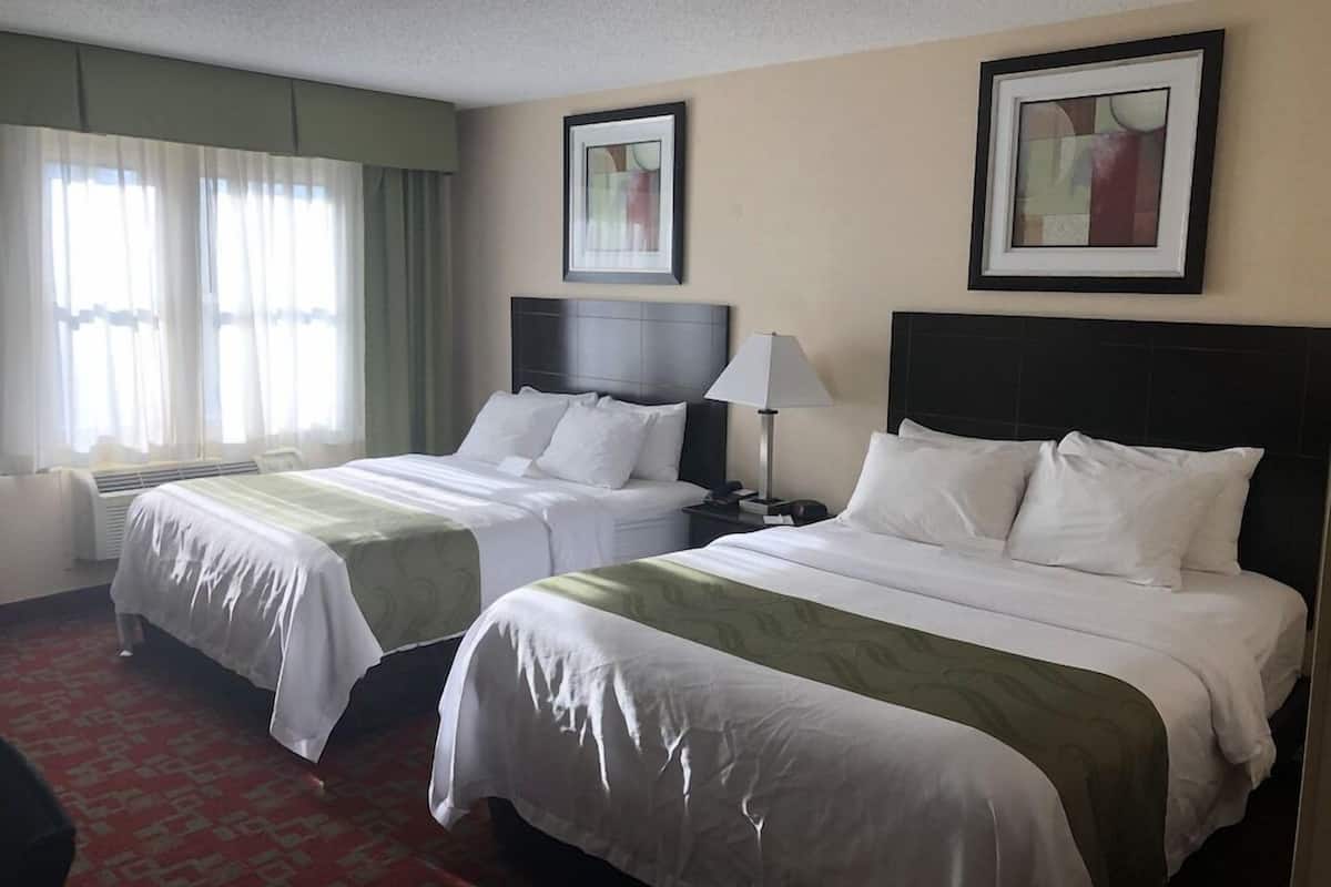 Premium bedding, pillowtop beds, desk, laptop workspace