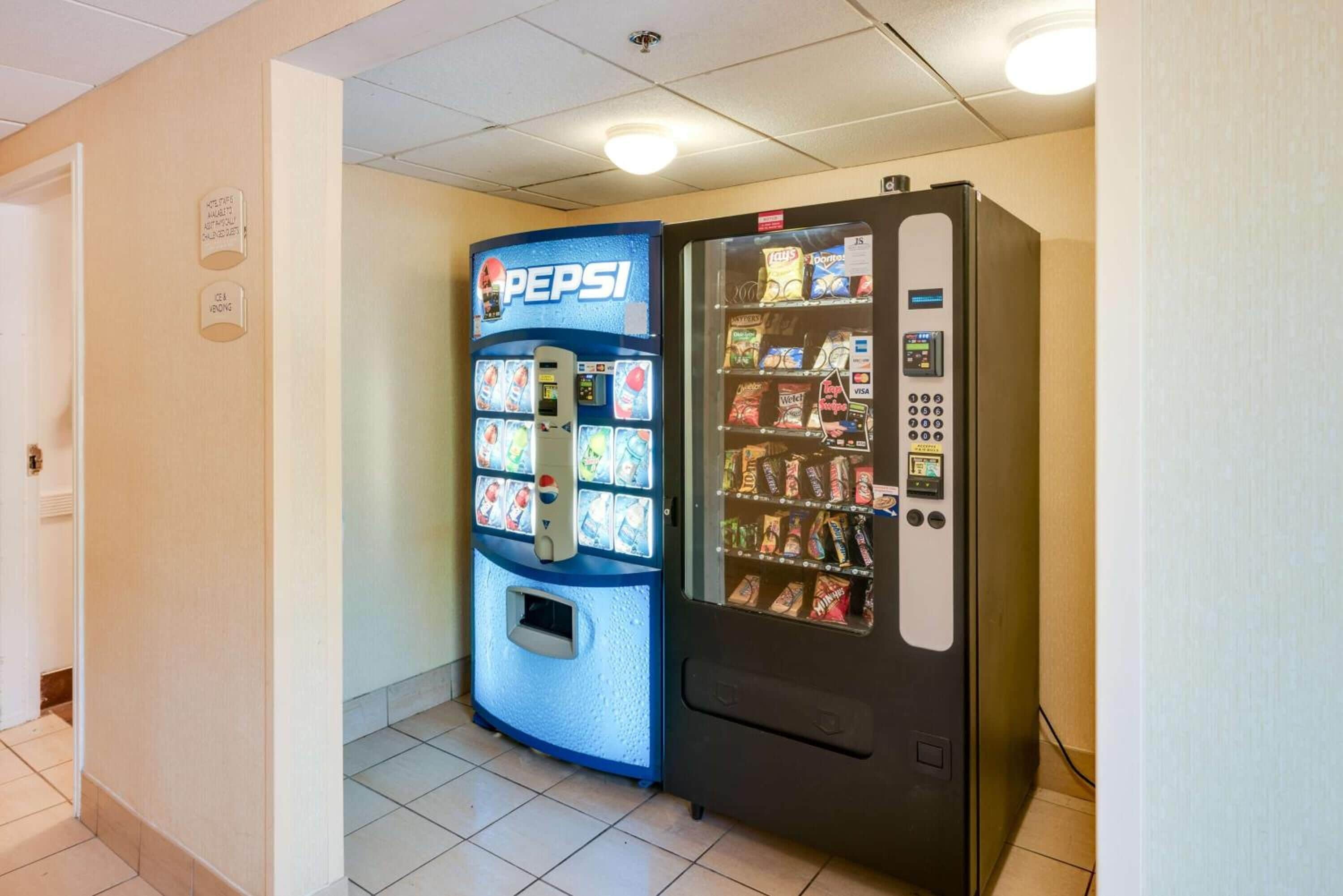 A vending machine area with a Pepsi machine and a snack vending machine.