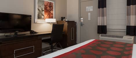 A hotel room with a bed, a desk with a TV, a chair, a painting, a window with curtains, and a thermostat.