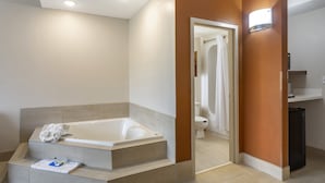 A modern bathroom with a bathtub, a toilet, and a sink. - Holiday Inn Express Branson-Green Mountain Drive by IHG (Branson)
