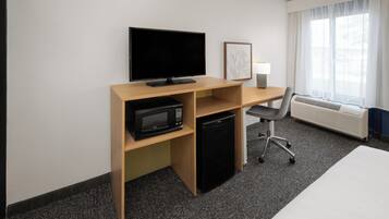 Desk, blackout drapes, iron/ironing board, free cribs/infant beds