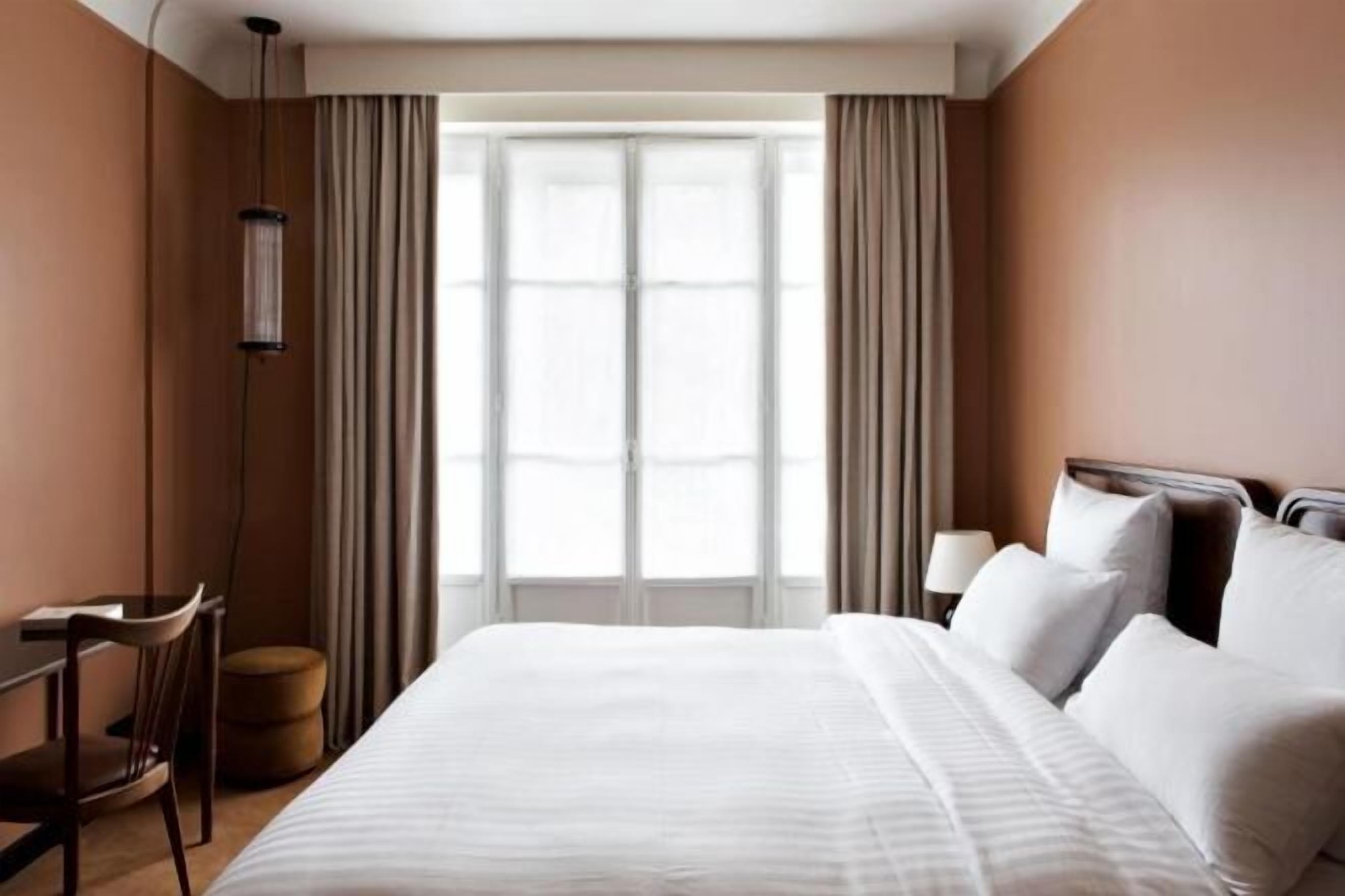 Premium bedding, memory-foam beds, minibar, in-room safe