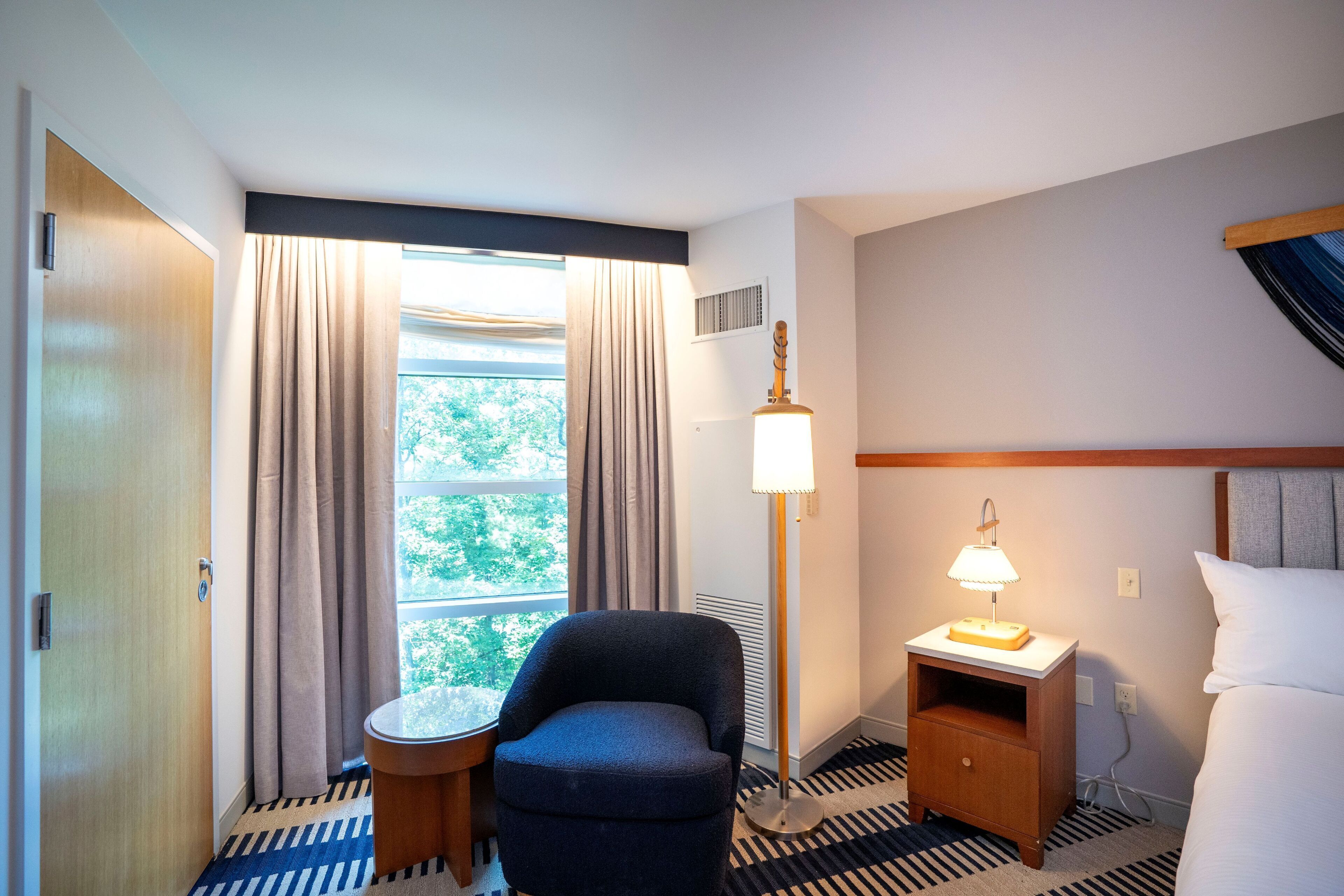 deluxe room | living area | 55-inch flat-screen tv with cable channels