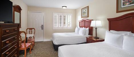 A hotel room with two beds, a dresser, a TV, a chair, a window with blinds, and a painting on the wall.